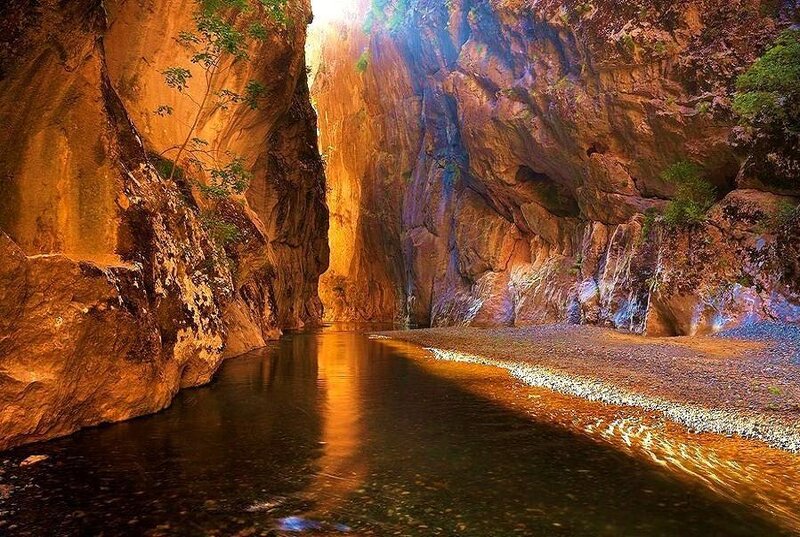 Sunlit canyon river gorge