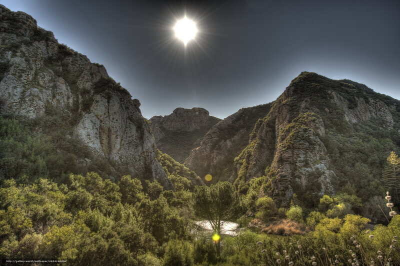 Sunlit canyon with river
