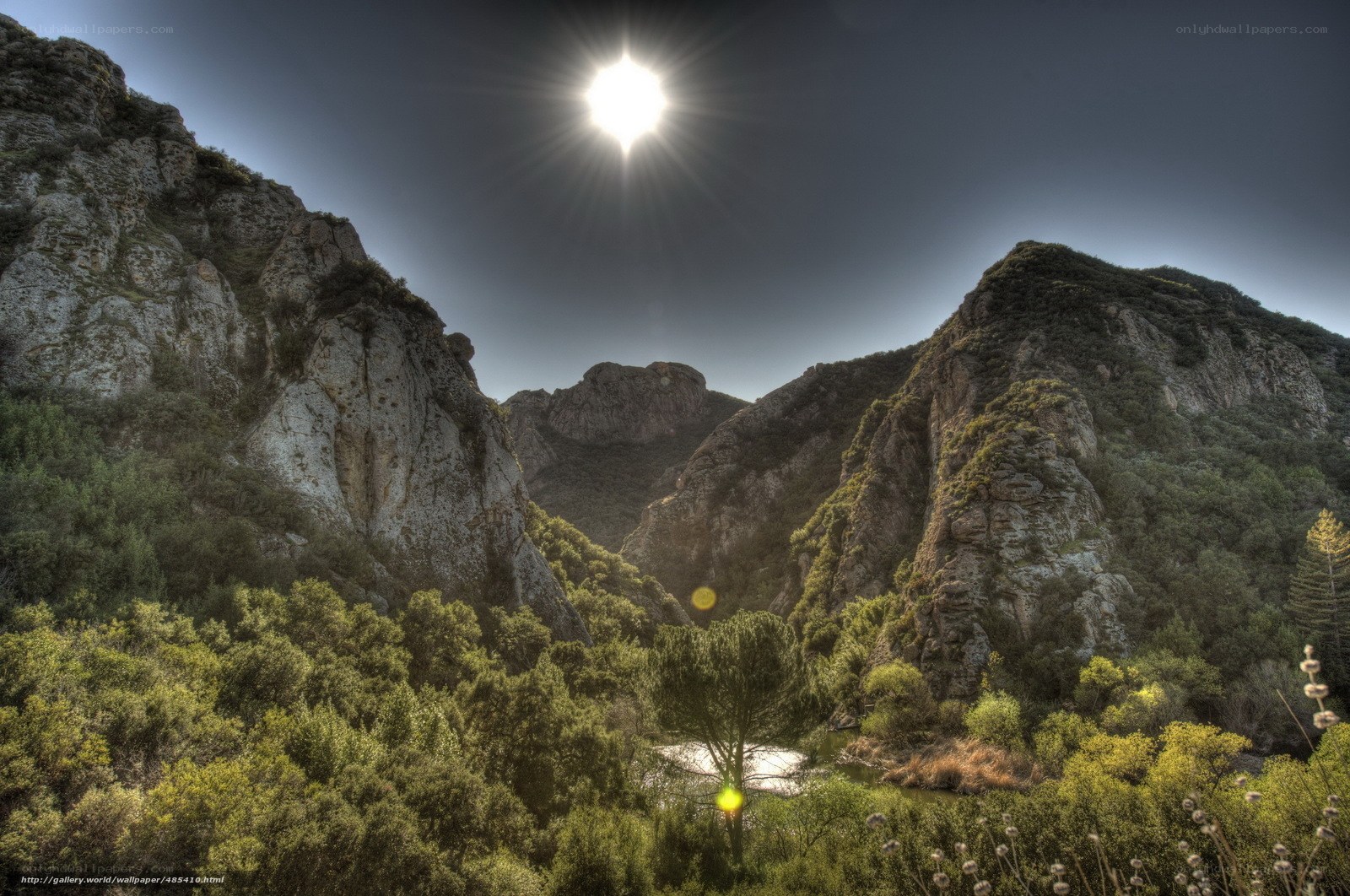 Sunlit canyon with river