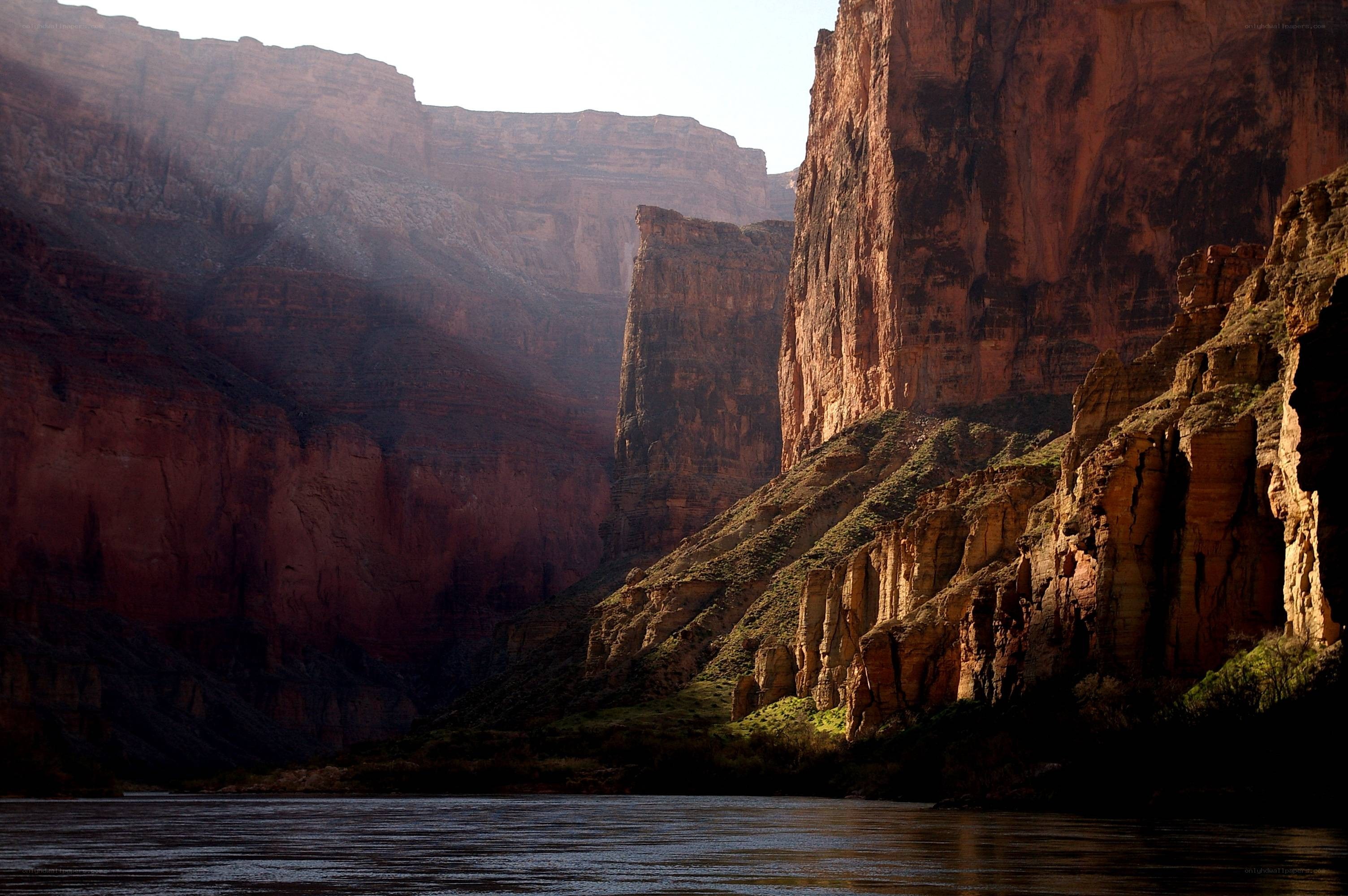 Sunlit canyon with river