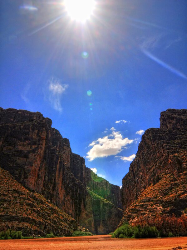 Sunlit canyon with river