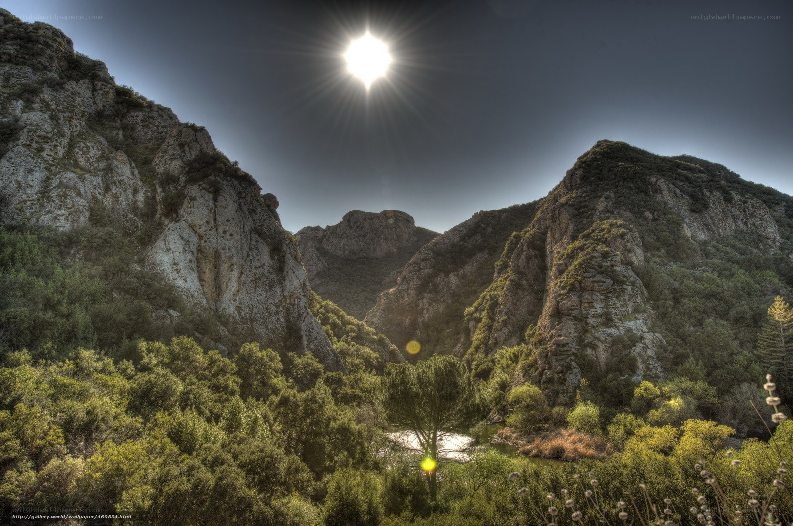 Sunlit canyon with river