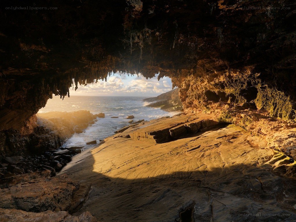 Sunlit cave overlooking the ocean