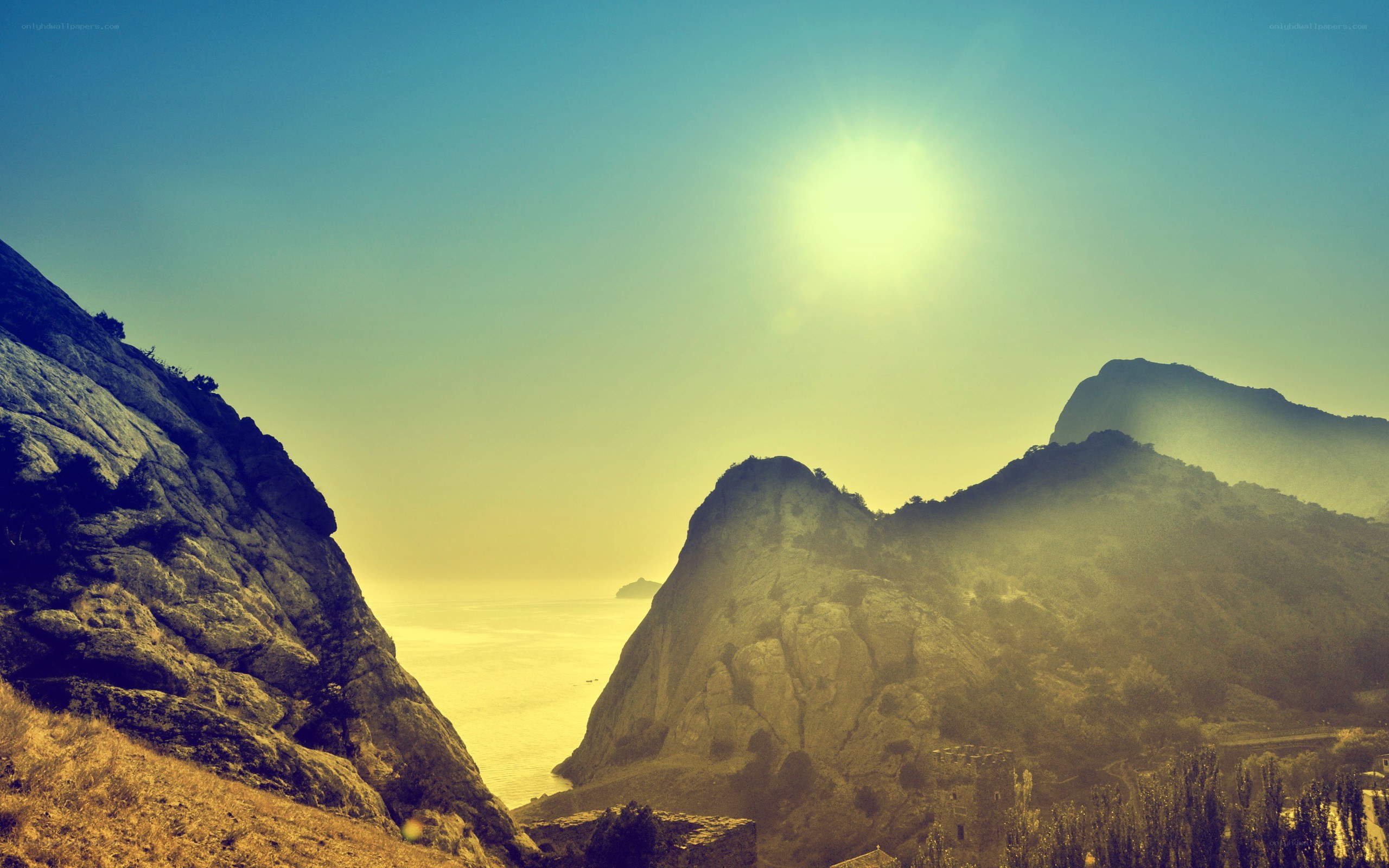 Sunlit coastal mountainscape