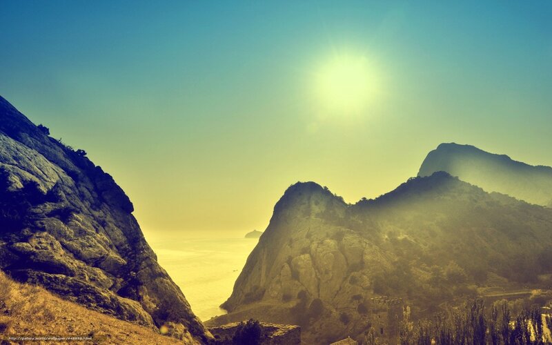 Sunlit coastal mountainscape