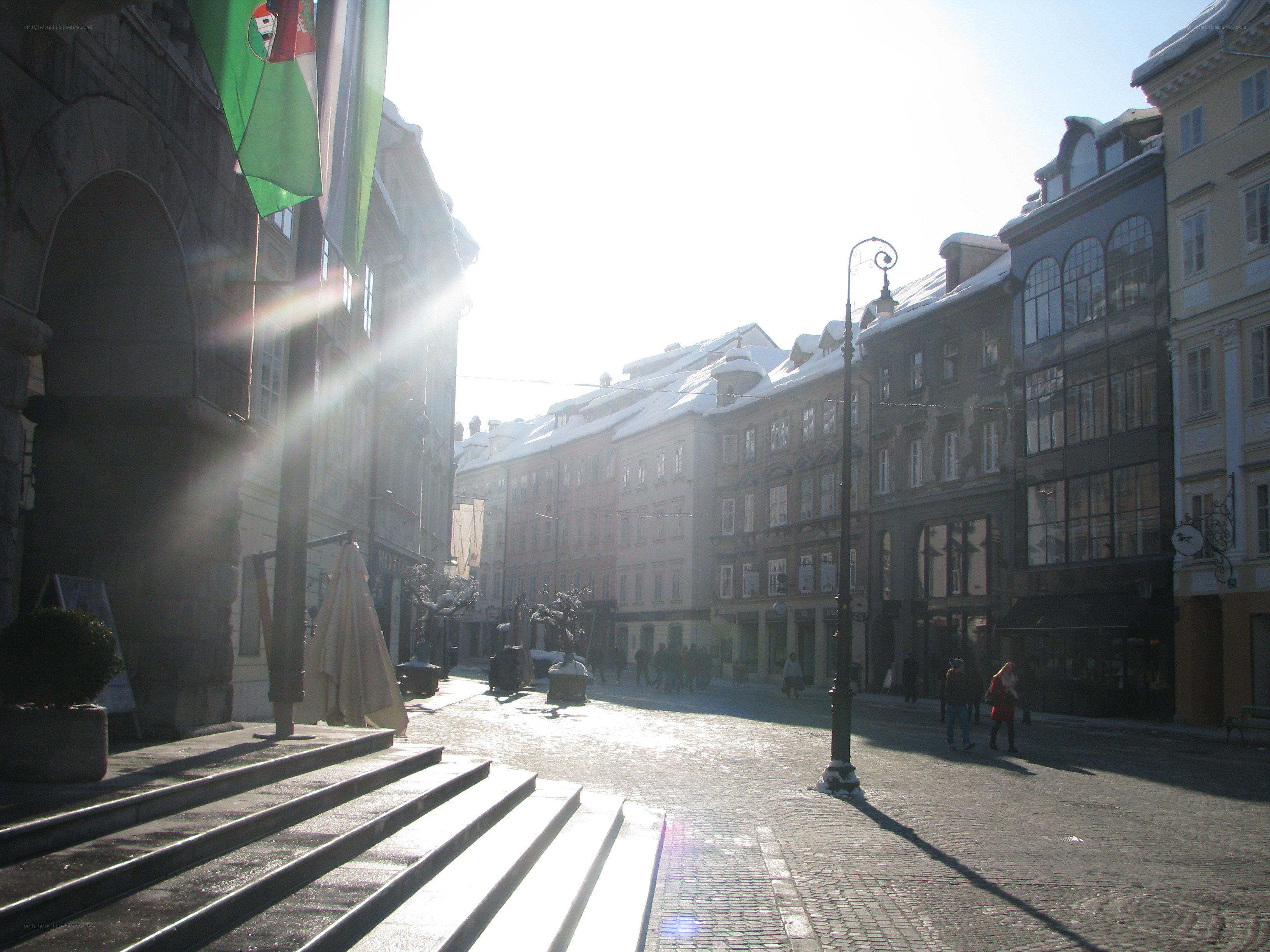 Sunlit cobblestone street in Prague