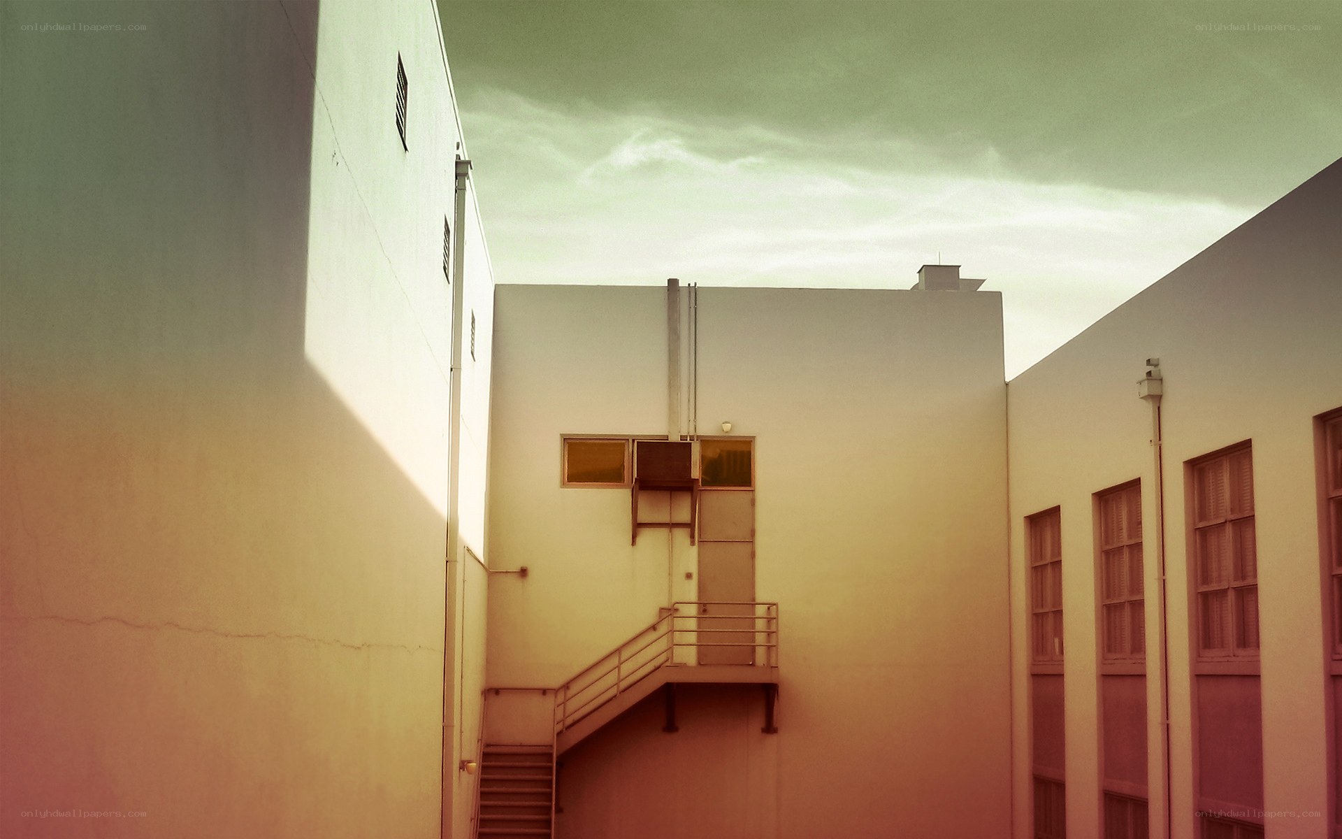 Sunlit courtyard with stairway