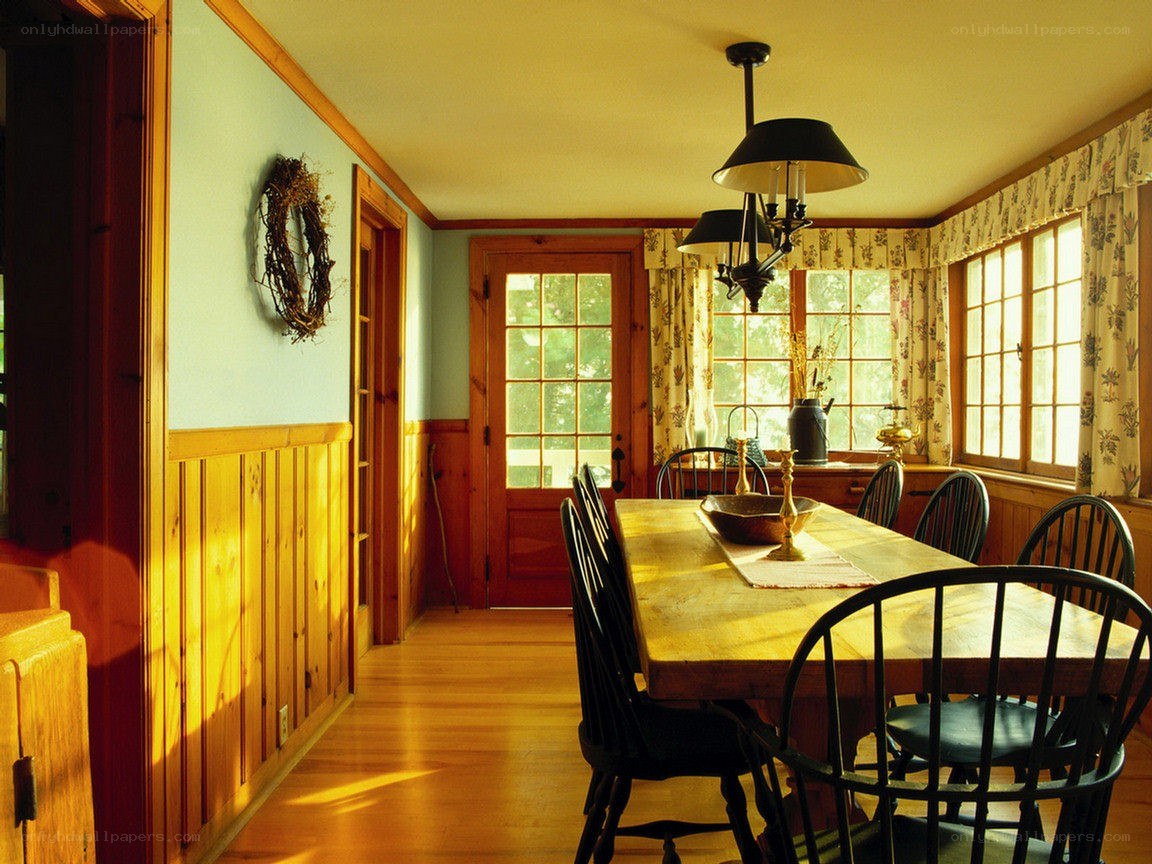 Sunlit dining room with wooden table