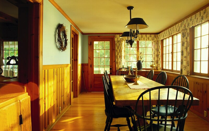 Sunlit dining room with wooden table