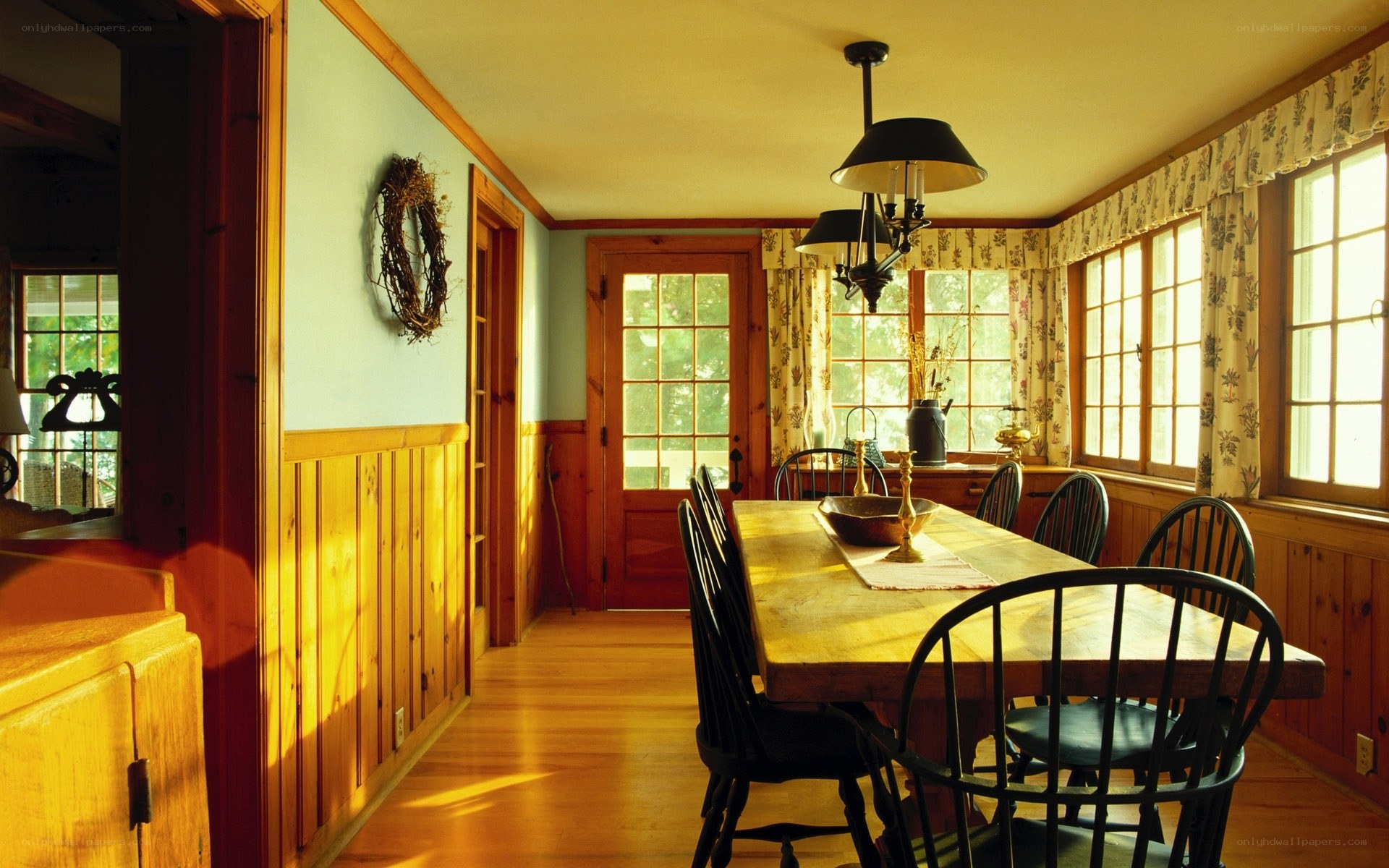 Sunlit dining room with wooden table