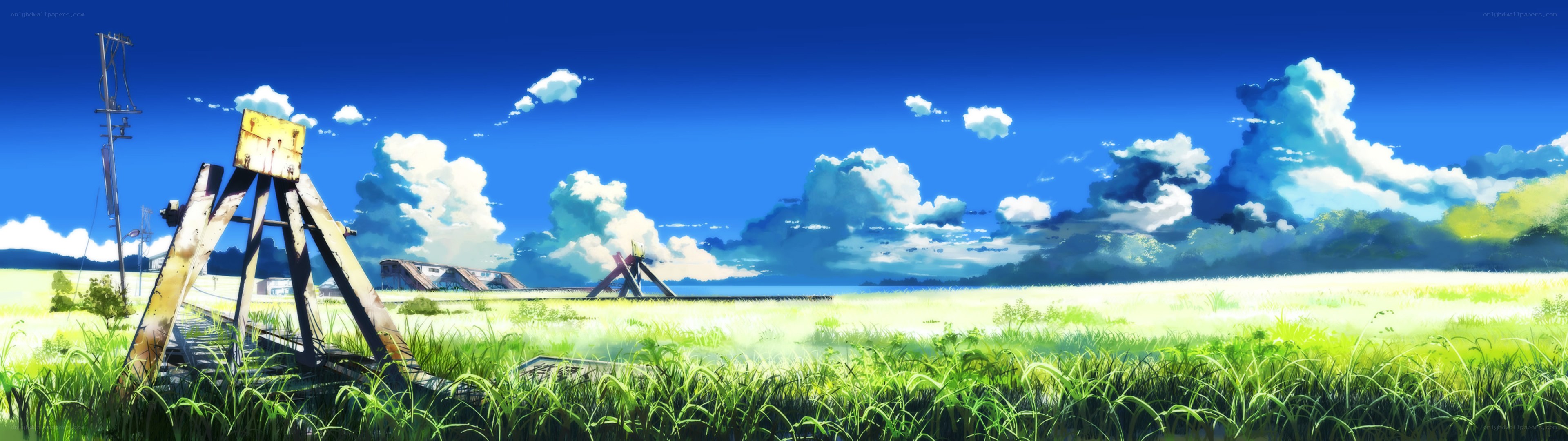 Sunlit field with old railway