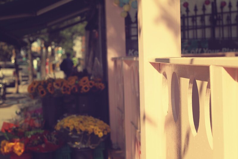 Sunlit flower stall on a city street
