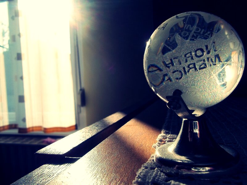 Sunlit globe on a windowsill