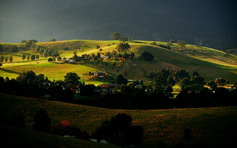 Sunlit hills and rural village