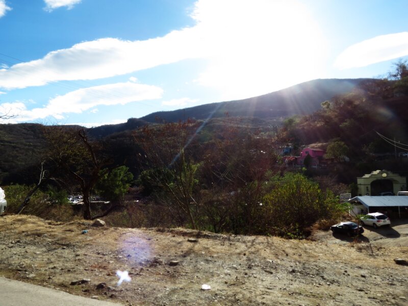 Sunlit hillside with houses