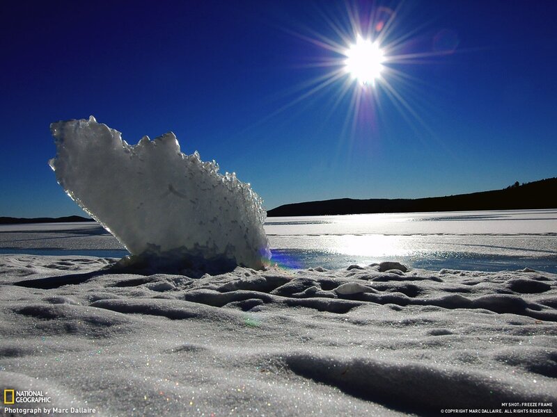 Sunlit ice on frozen lake