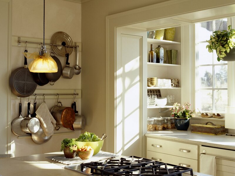 Sunlit kitchen with hanging pots