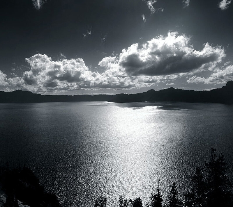 Sunlit lake with clouds