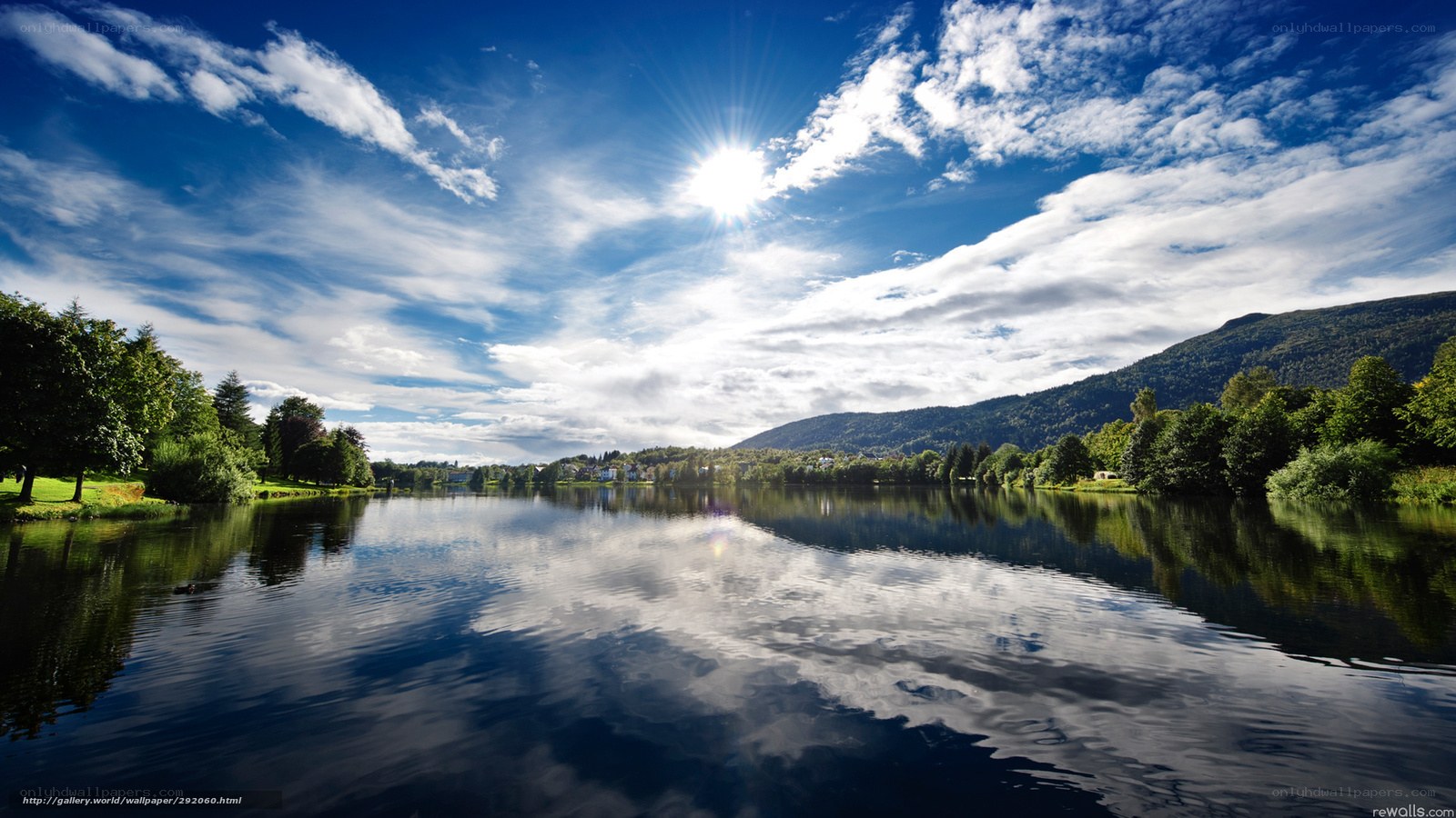 Sunlit lake with mountain view