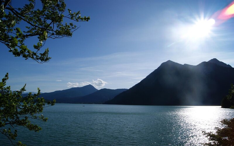 Sunlit lake with mountains