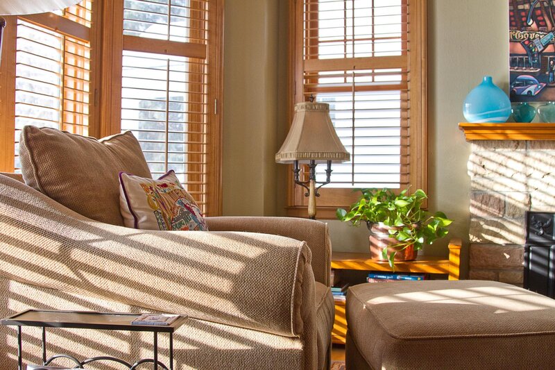 Sunlit living room with armchair