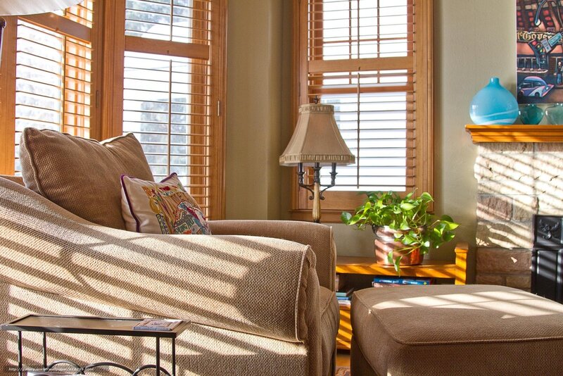 Sunlit living room with armchair