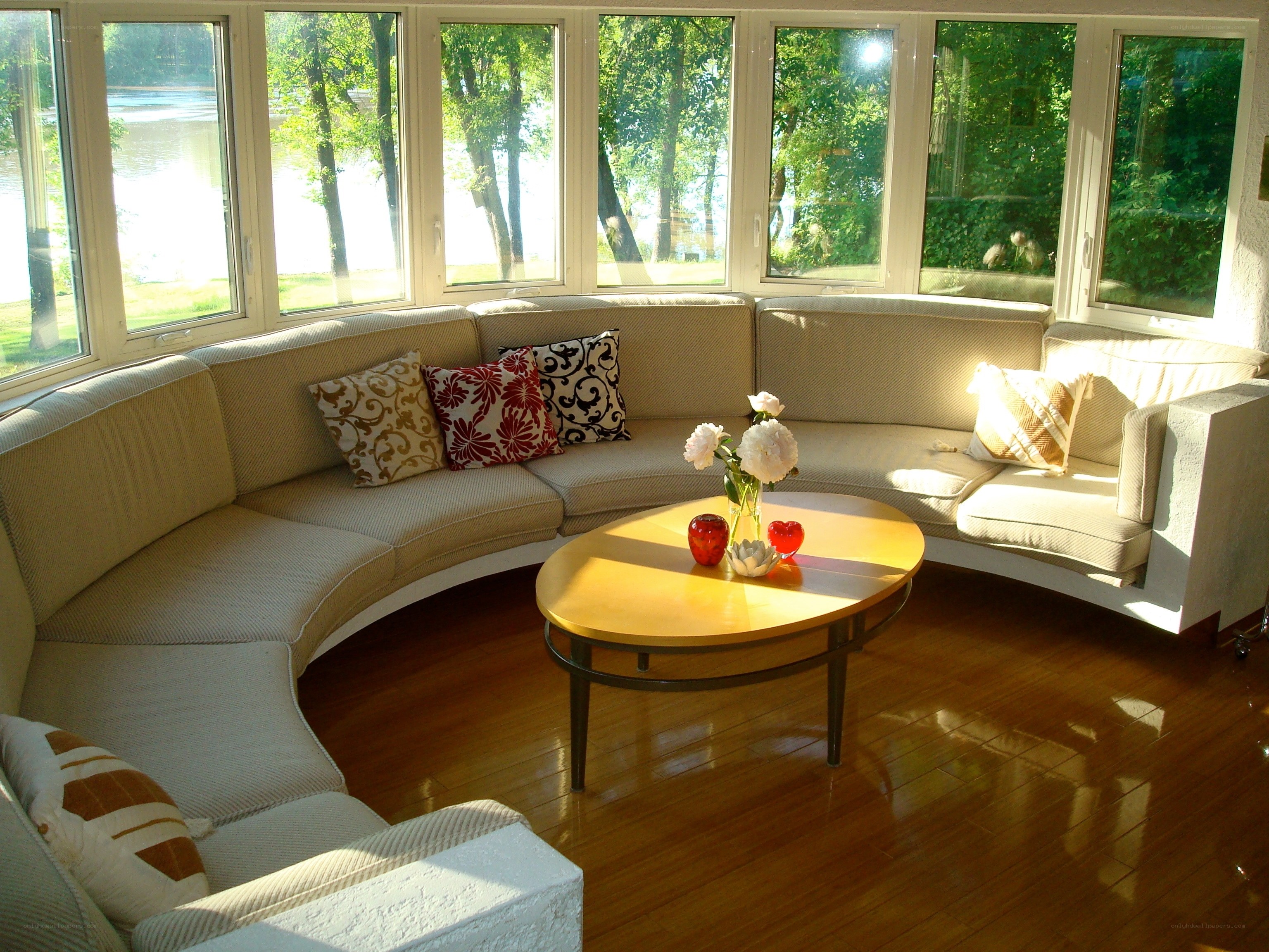 Sunlit living room with bay windows