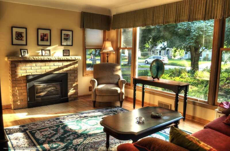 Sunlit living room with fireplace