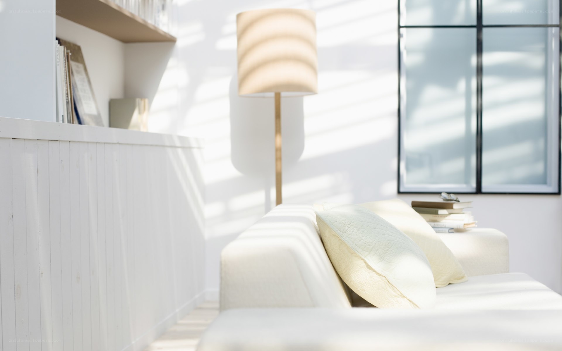 Sunlit living room with sofa
