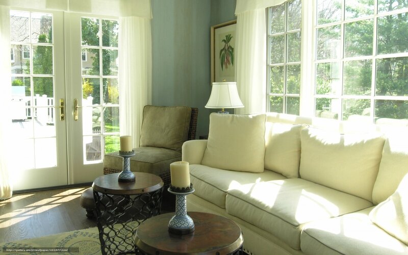 Sunlit living room with white sofa