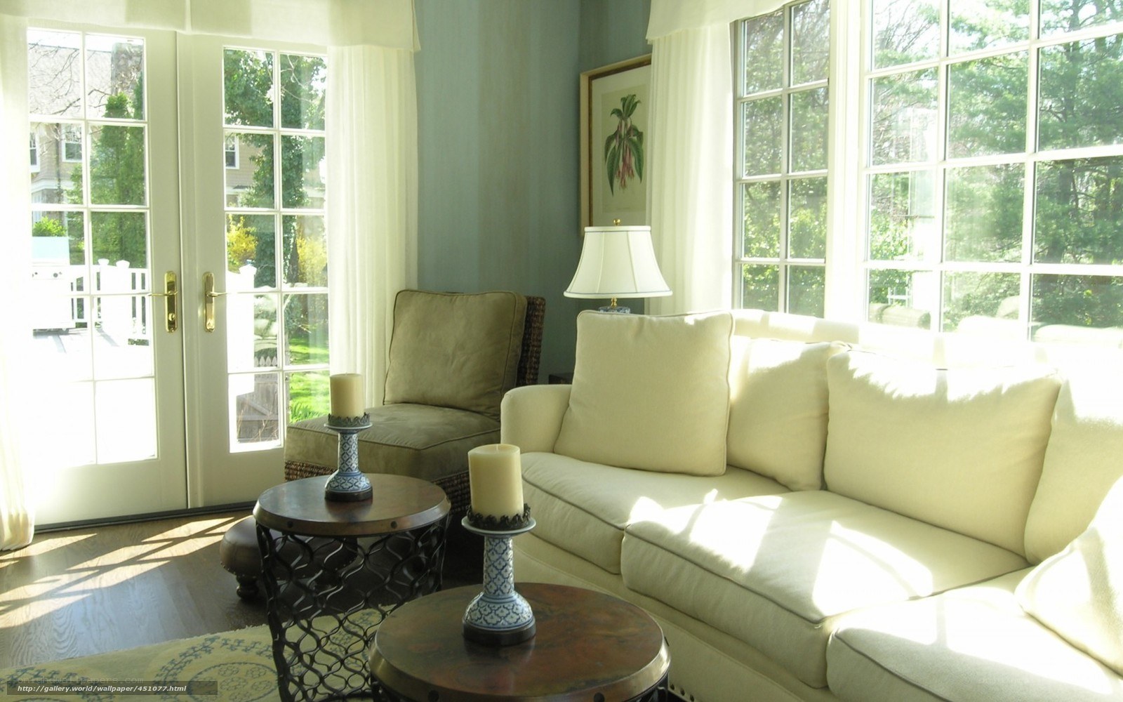 Sunlit living room with white sofa