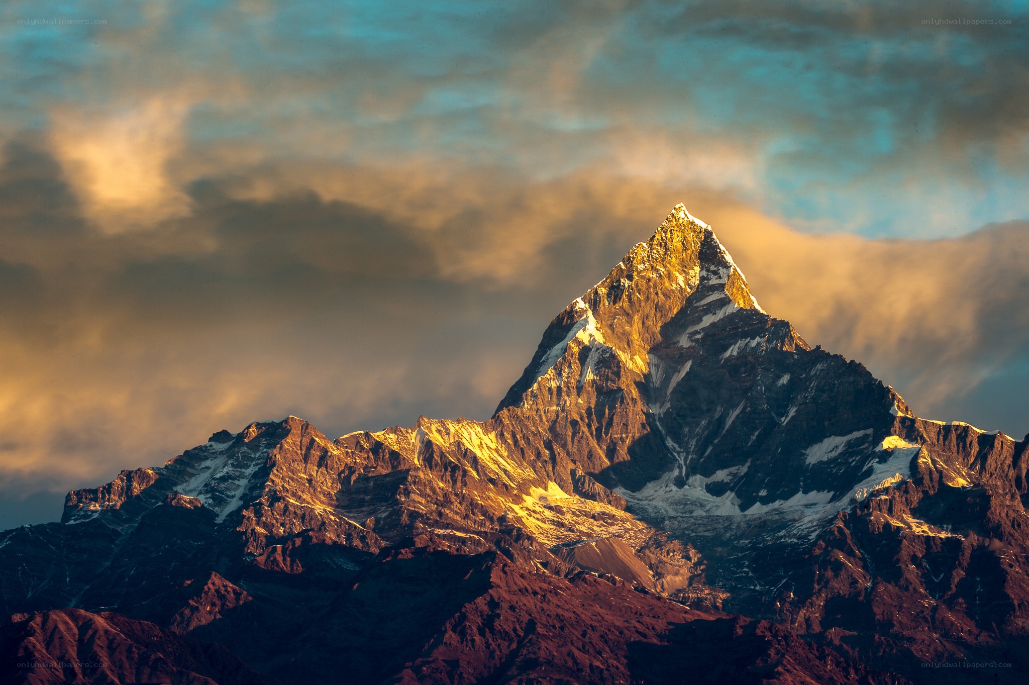 Sunlit mountain peak at dawn