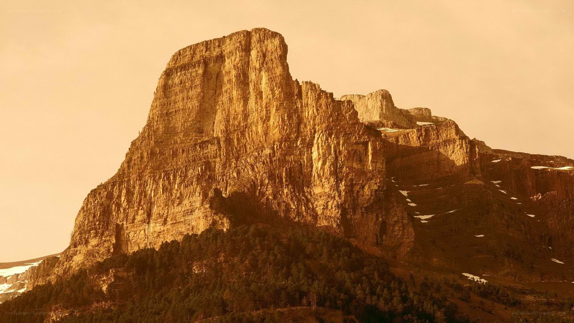 Sunlit mountain peak at dawn