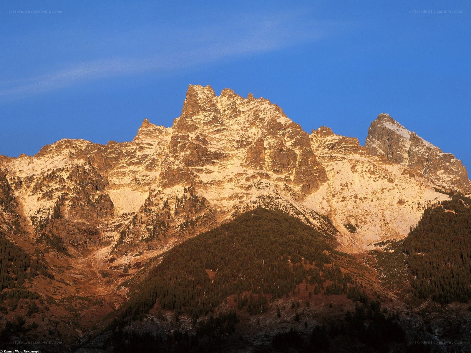 Sunlit mountain peak at dawn