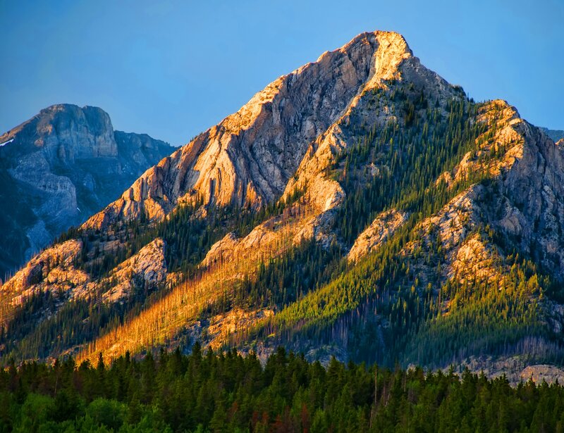 Sunlit mountain peak at dawn