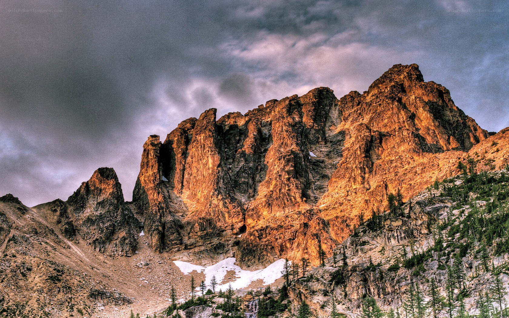 Sunlit mountain peak at dusk