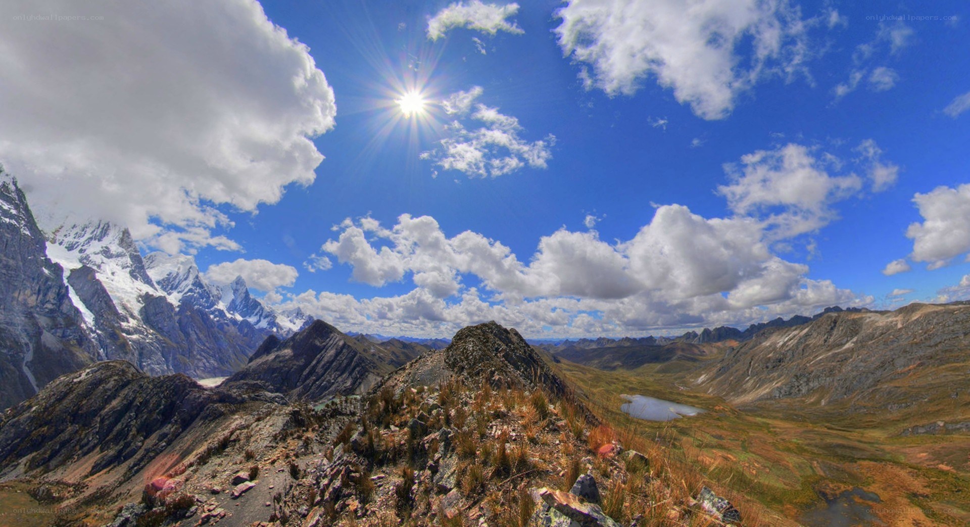 Sunlit mountain peaks and clouds