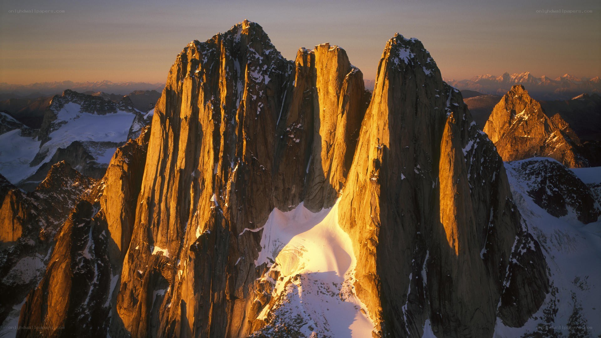 Sunlit mountain peaks at dawn