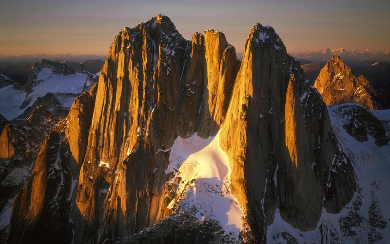 Sunlit mountain peaks at dawn