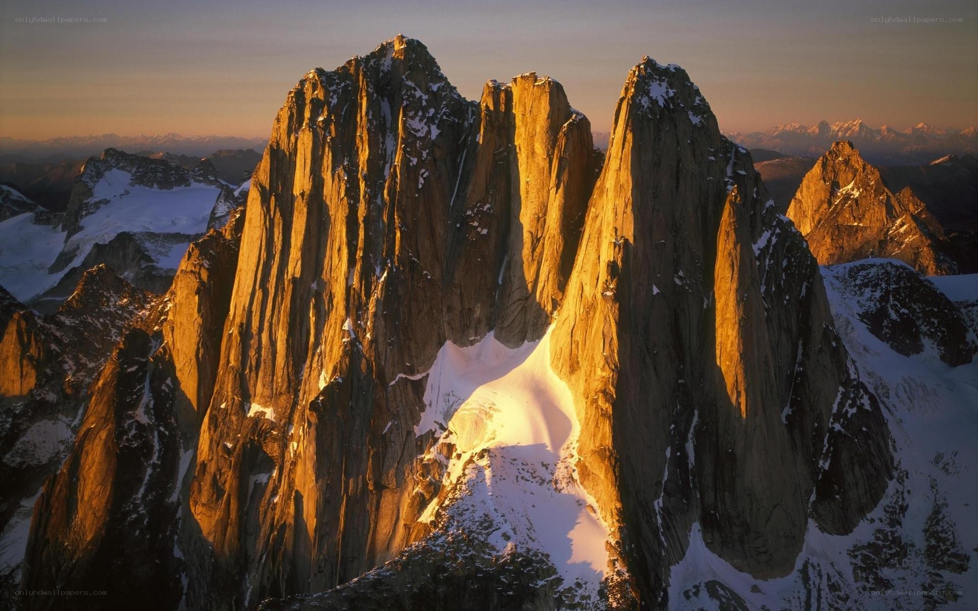 Sunlit mountain peaks at dawn
