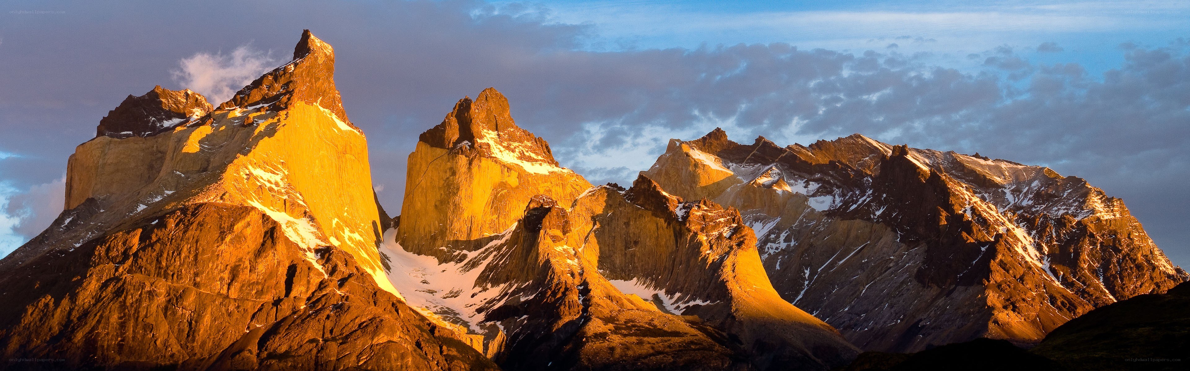 Sunlit mountain peaks at dawn
