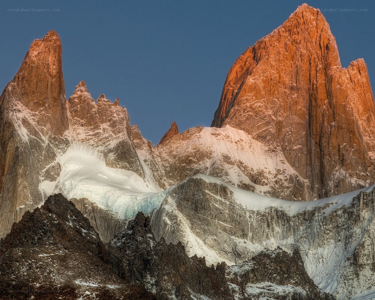 Sunlit mountain peaks at dawn