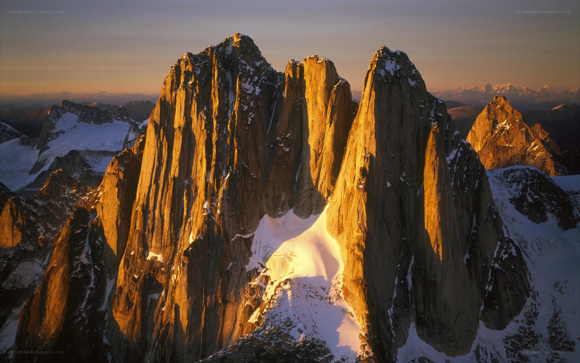 Sunlit mountain peaks at dawn