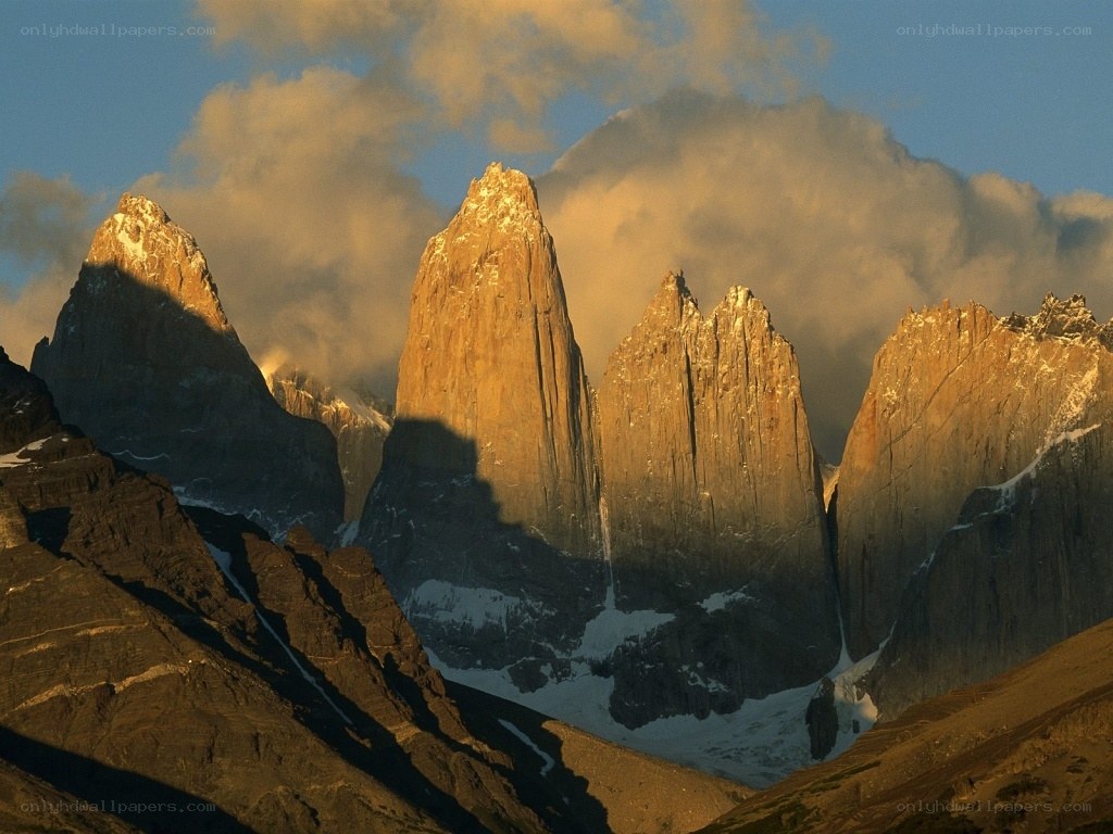 Sunlit mountain peaks at dawn