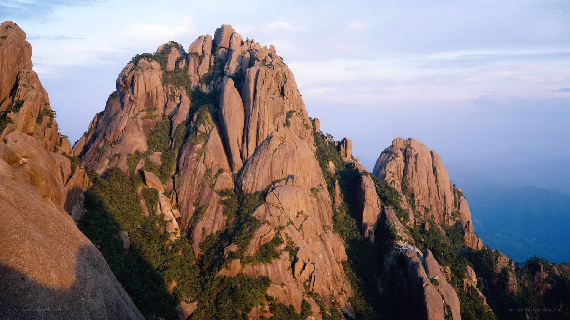 Sunlit mountain peaks at dawn