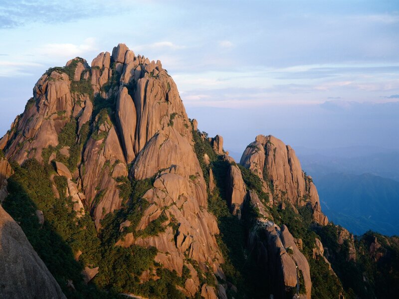Sunlit mountain peaks at dawn