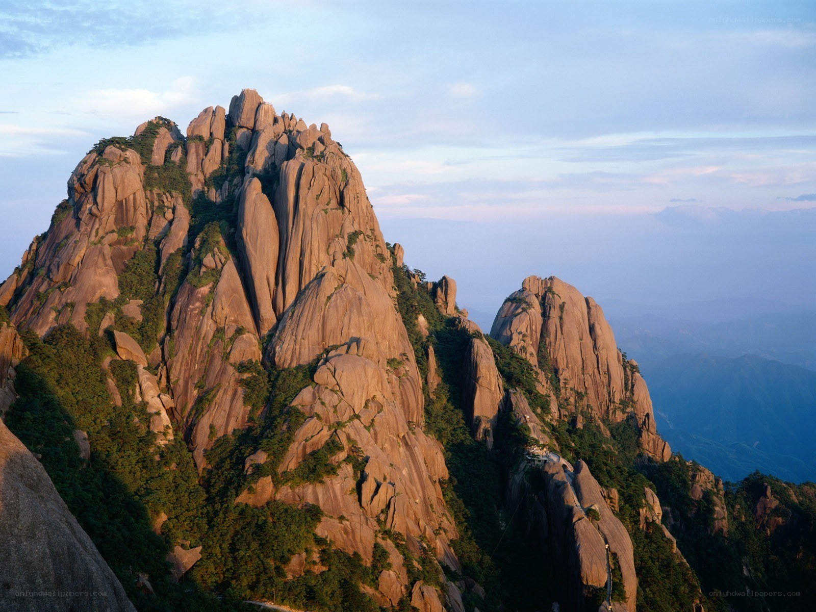 Sunlit mountain peaks at dawn