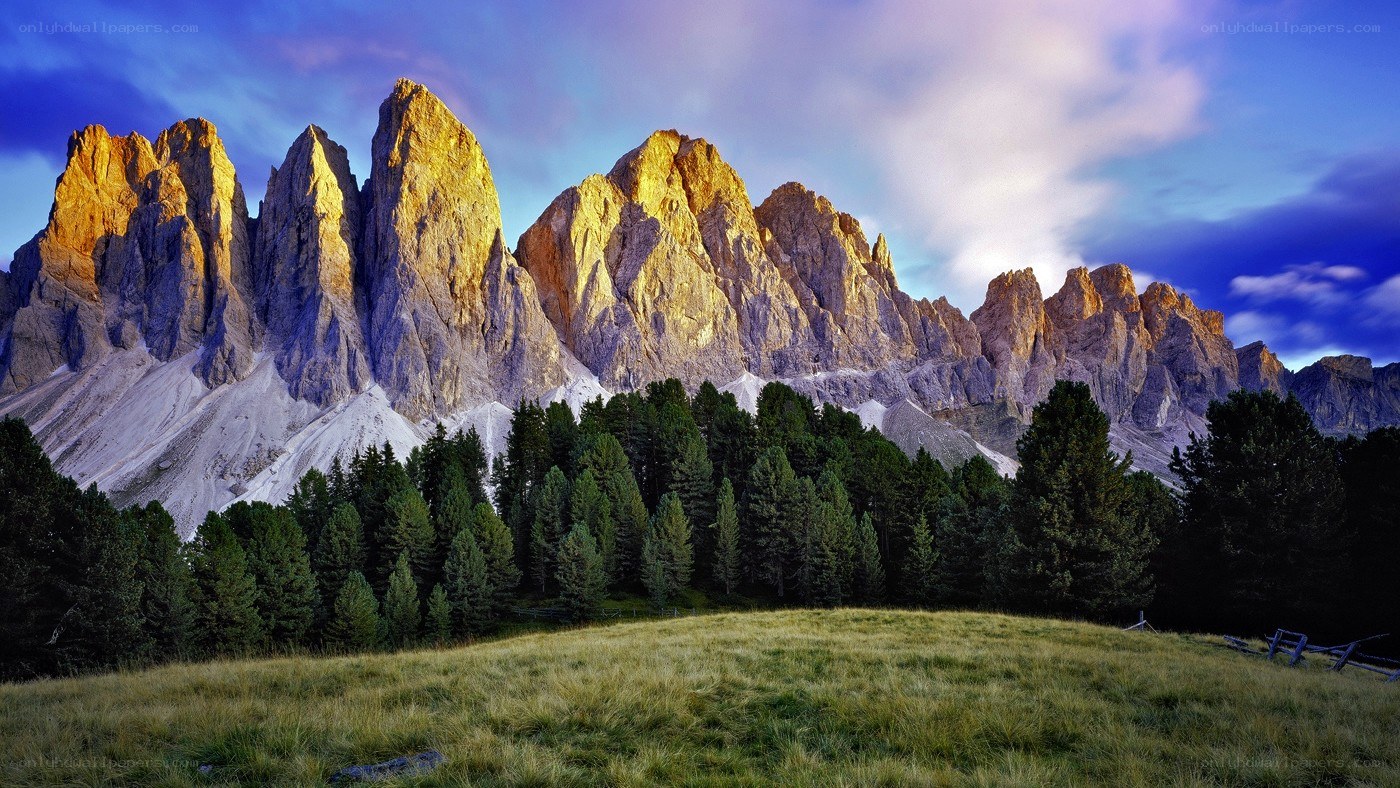 Sunlit mountain peaks at dusk