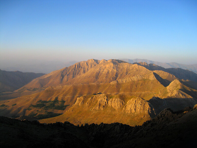 Sunlit mountain range at dawn