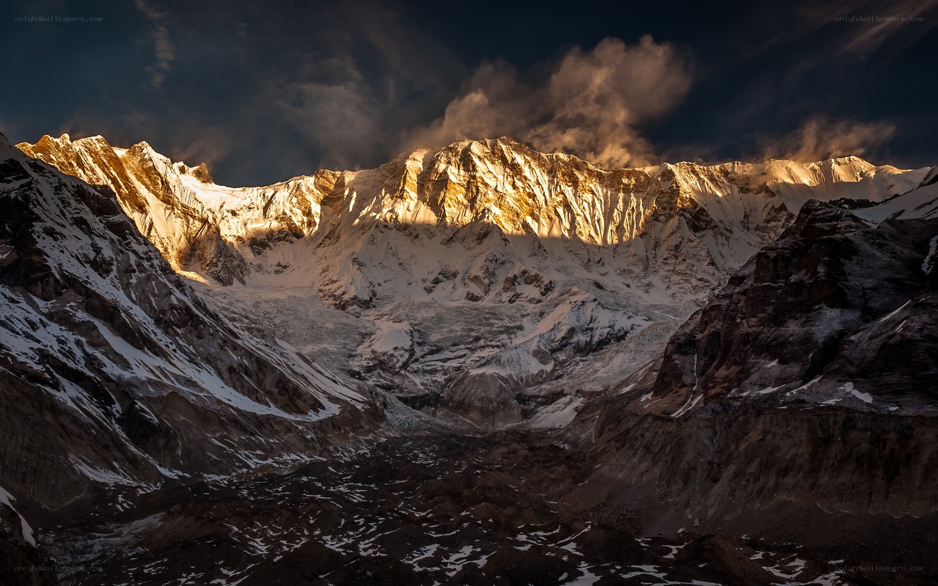 Sunlit mountain range at dawn